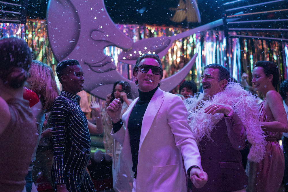 HALSTON (L to R) EWAN MCGREGOR as HALSTON, DAVID PITTU as JOE EULA, and REBECCA DAYAN as ELSA PERETTI in episode 104 of HALSTON Cr. ATSUSHI NISHIJIMA/NETFLIX © 2021