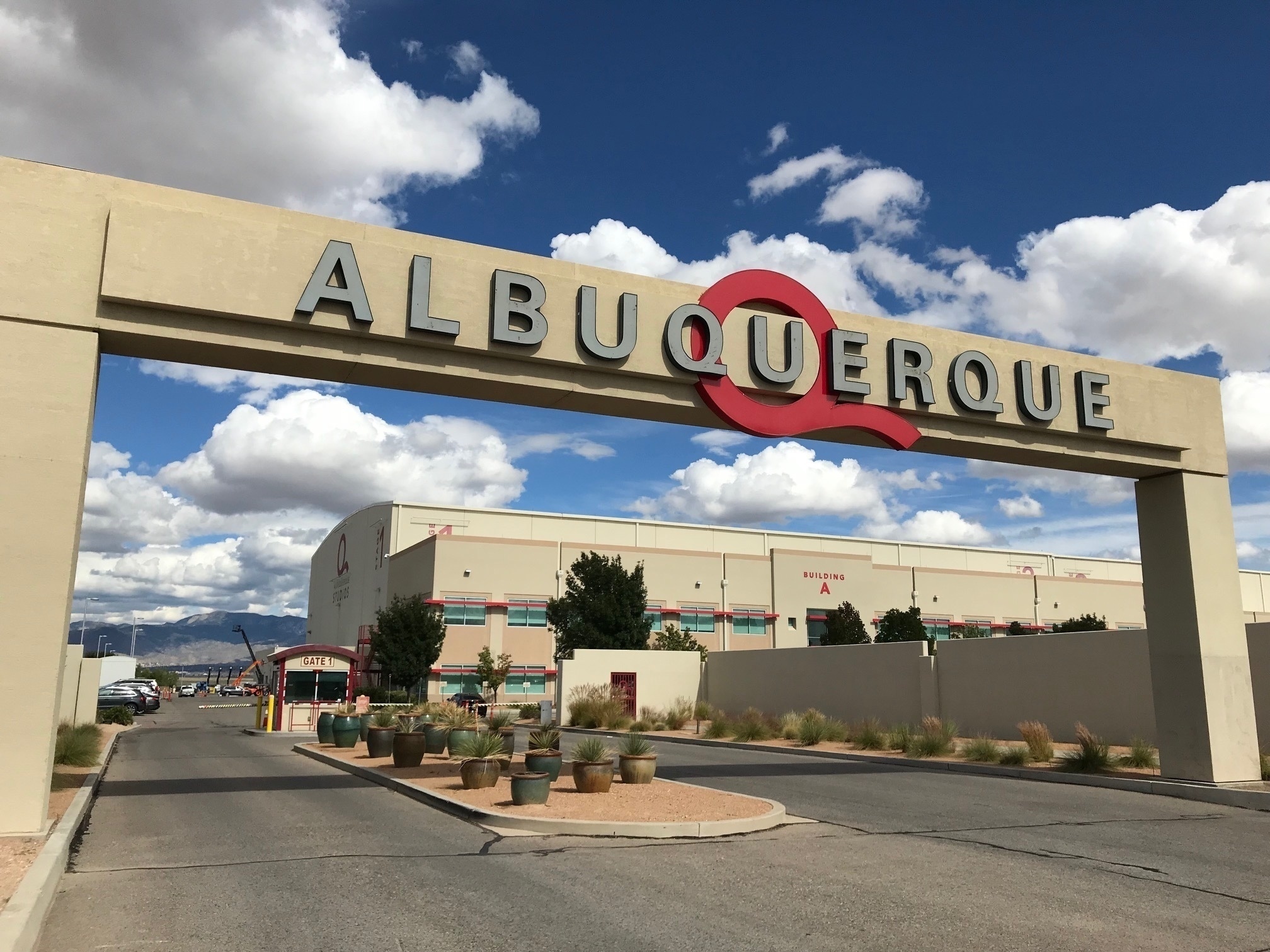 FILE - In this Oct. 8, 2018, file photo, is the entrance to ABQ Studios in Albuquerque, N.M., where Netflix announced at the studio complex that it chose Albuquerque as a new production hub. Netflix is pledging an additional $1 billion investment in its production hub in New Mexico. The company joined government officials Monday, Nov. 23, 2020, in announcing its plans. The expansion will add about 300 acres to the existing campus on the southern edge of Albuquerque, making it what officials say will be one of the largest film production facilities in North America. (AP Photo/Susan Montoya Bryan, File)