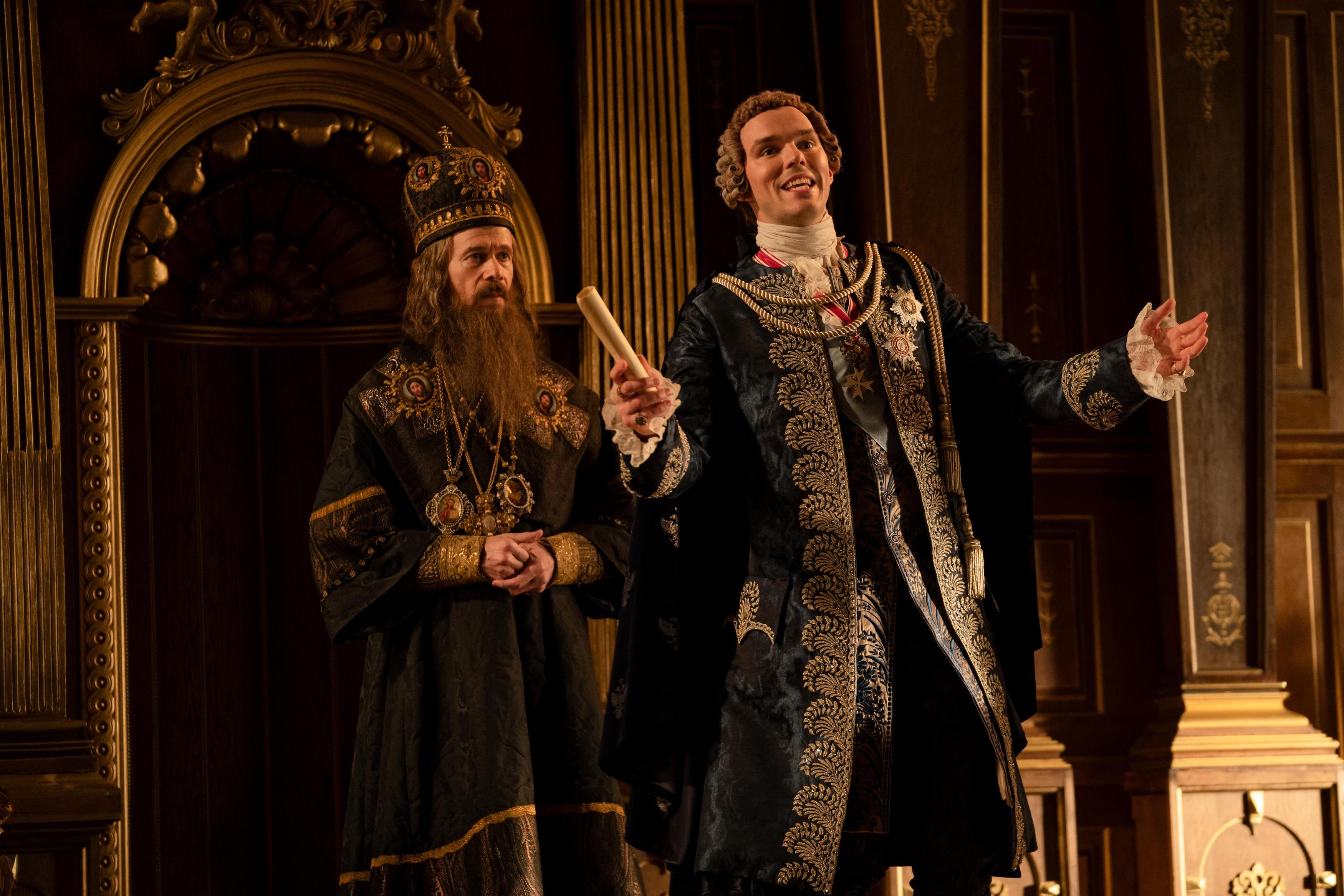 The Great -- “Dickhead” - Episode 202 -- Catherine, Orlo and Velementov begin their rule of Russia and unexpected obstacles appear for her. Peter is on a journey of self-improvement under house arrest but convinces Catherine to let him attend her coronation and hand over his crown. Archbishop (Adam Godley) and Peter (Nicholas Hoult), shown. (Photo by: Gareth Gatrell/Hulu)