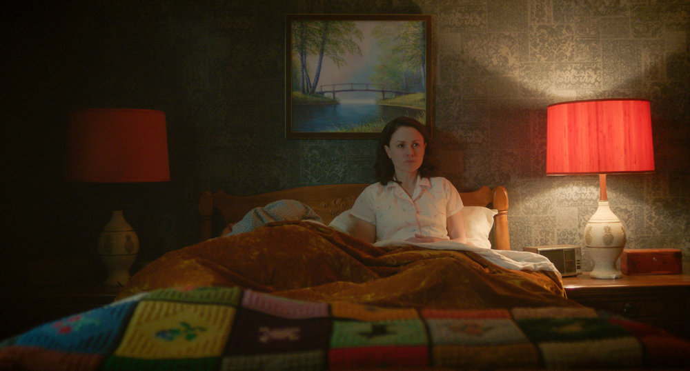 A FRIEND OF THE FAMILY -- “Articles of Faith” Episode 104 -- Pictured: Anna Paquin as Mary Ann Broberg -- (Photo by: Peacock)