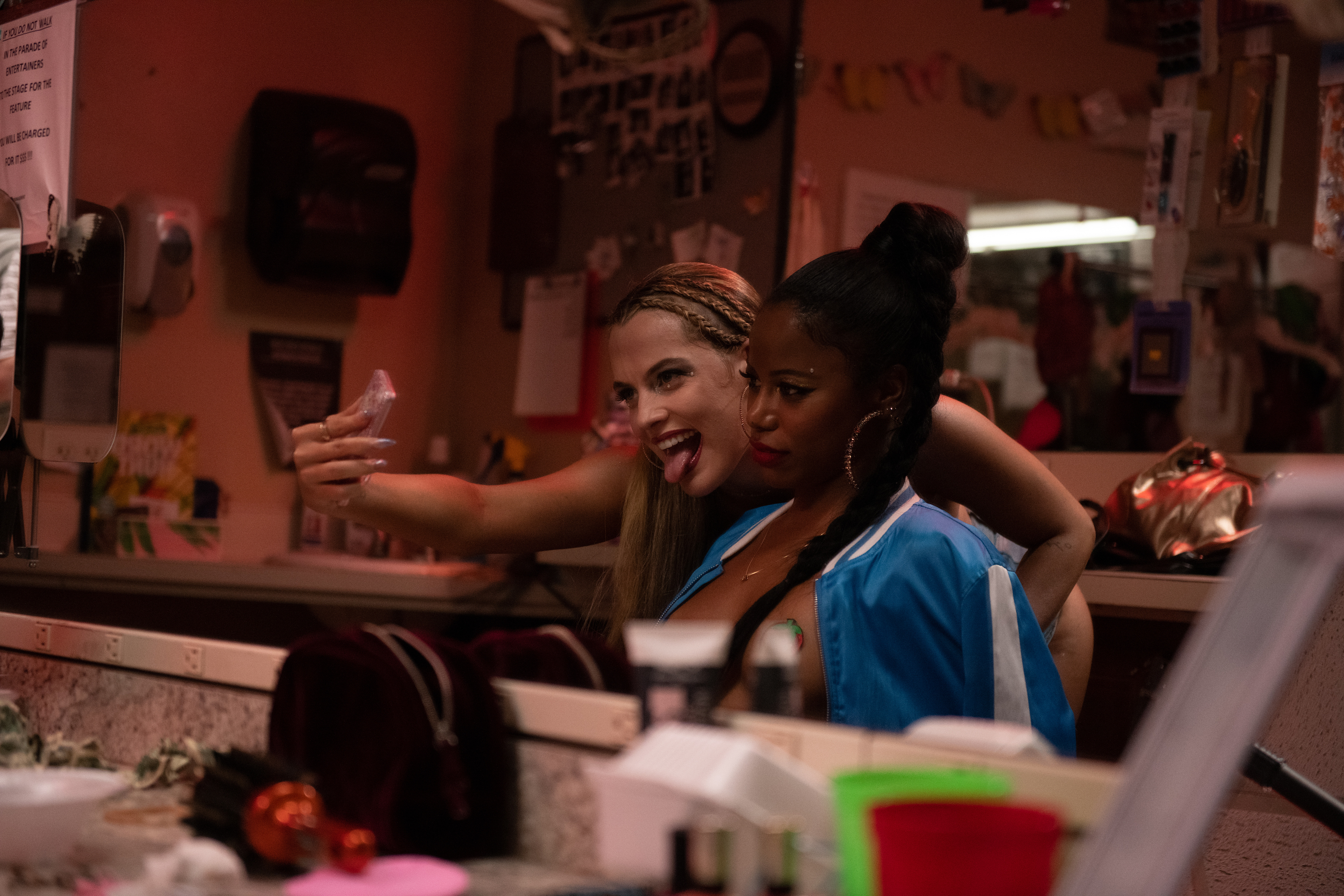 Riley Keough (left) stars as Stefani and Taylour Paige (right) stars as Zola in director Janicza Bravo's ZOLA, an A24 Films release. Cr. Anna Kooris / A24 Films