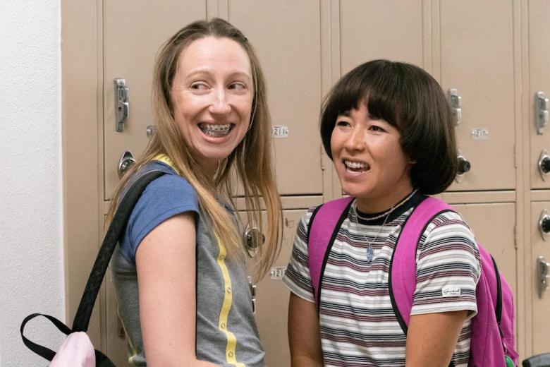 PEN15 -- Play - Episode 206 -- The school play has been cast. Maya has the opportunity to get her actual first kiss. Anna struggles to find herself. Anna Kone (Anna Konkle) and Maya Ishii-Peters (Maya Erskine), shown. (Photo by: Lara Solanki/Hulu)