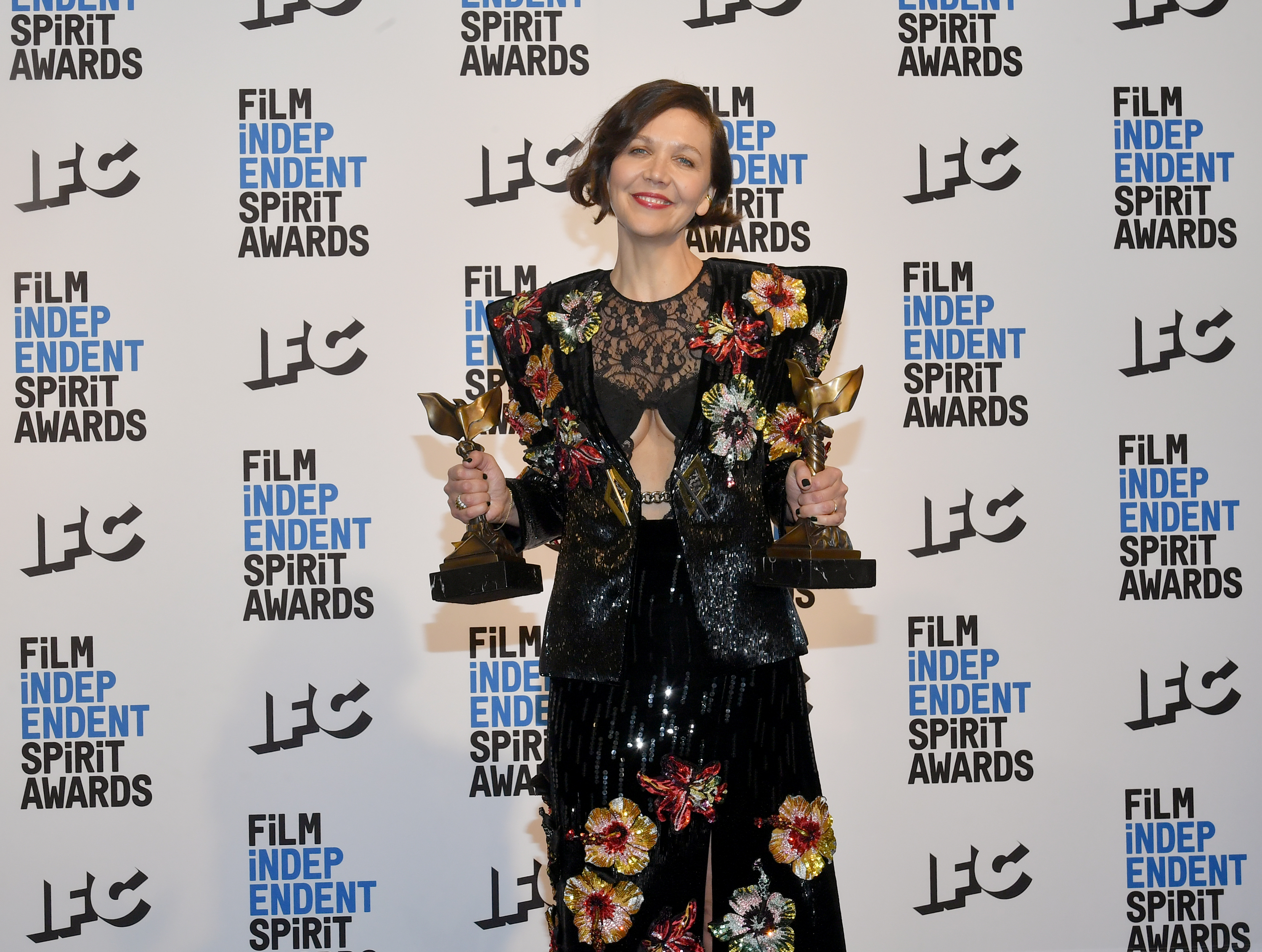 Maggie Gyllenhaal, winner of the Best Feature, Best Director, and Best Screenplay awards for The Lost Daughter at the 37th Annual Independent Spirit Awards held at Santa Monica Pier on March 6th, 2022 in Santa Monica, California.