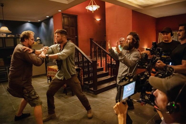 EXTRACTION, from left: David Harbour, Chris Hemsworth, director Sam Hargrave, on-set, 2020. ph: Jasin Boland / © Netflix / Courtesy Everett Collection