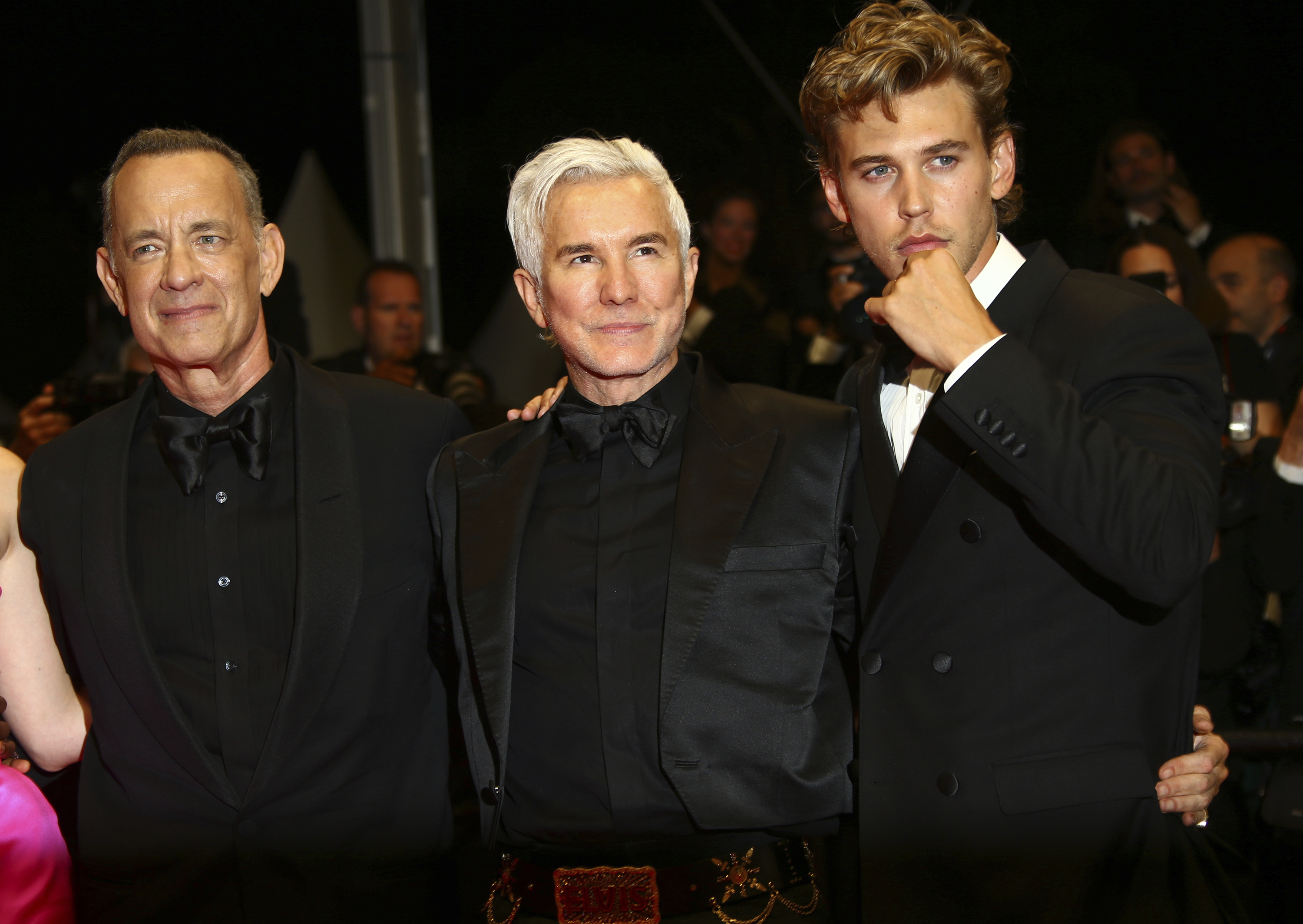 Tom Hanks, from left, Baz Luhrmann, and Austin Butler pose for photographers upon departure from the premiere of the film 'Elvis' at the 75th international film festival, Cannes, southern France, Wednesday, May 25, 2022. (Photo by Joel C Ryan/Invision/AP)