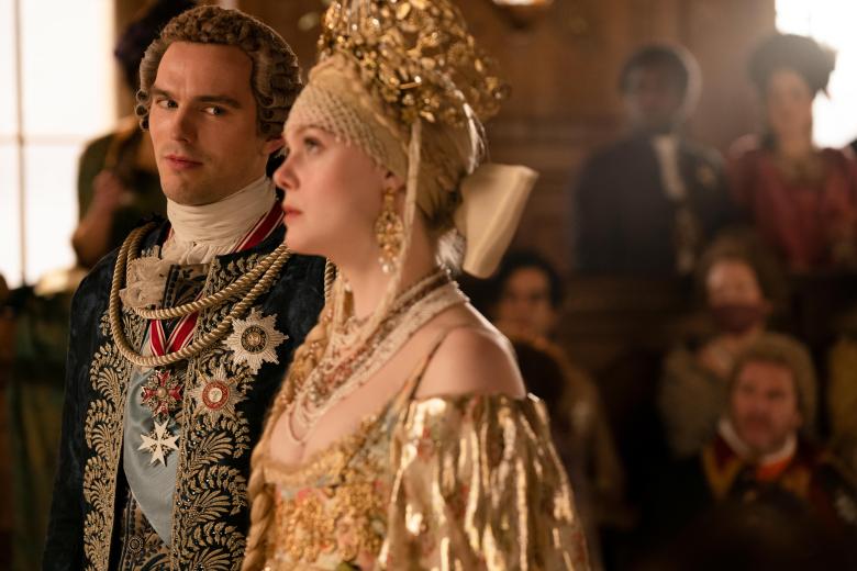 The Great -- “Dickhead” - Episode 202 -- Catherine, Orlo and Velementov begin their rule of Russia and unexpected obstacles appear for her. Peter is on a journey of self-improvement under house arrest but convinces Catherine to let him attend her coronation and hand over his crown. Peter (Nicholas Hoult) and Catherine (Elle Fanning), shown. (Photo by: Gareth Gatrell/Hulu)