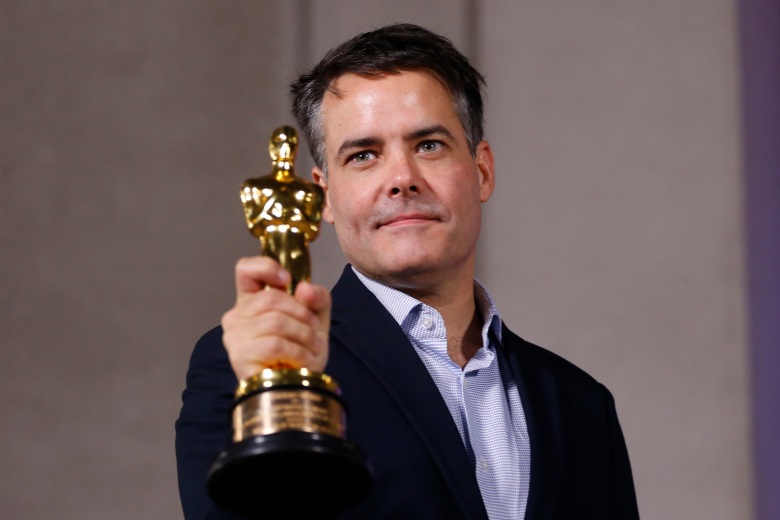 Chilean filmmaker Sebastian Lelio shows the Oscar statuette for Best Foreign Language Film won by his film A Fantastic Woman after a meeting with Chilean President Michelle Bachelet (out of frame) outside La Moneda presidential Palace in Santiago, on March 6, 2018. / AFP PHOTO / Pablo VERA (Photo credit should read PABLO VERA/AFP via Getty Images)