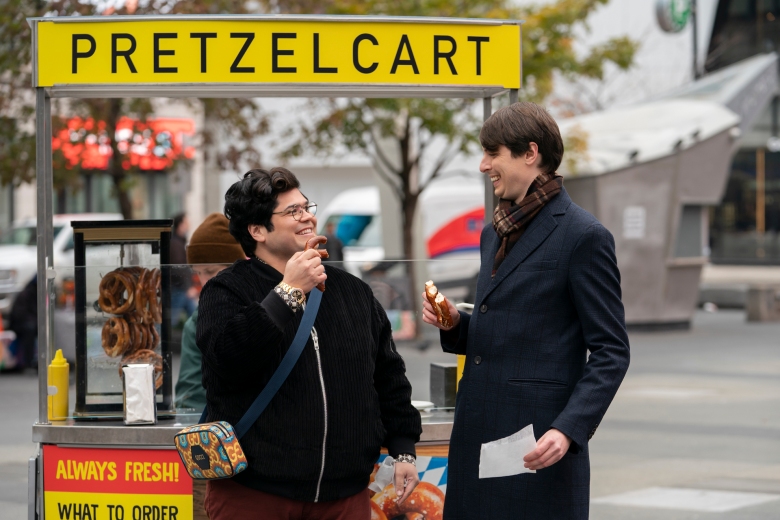 Two men enjoying pretzels from a pretzel cart; still from What We Do in the Shadows