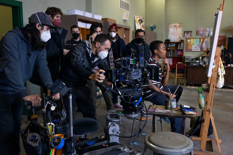 Cinematographer Lyle Vincent uses a Sony Venice camera to film actor Asante Blackk sitting at an easel.