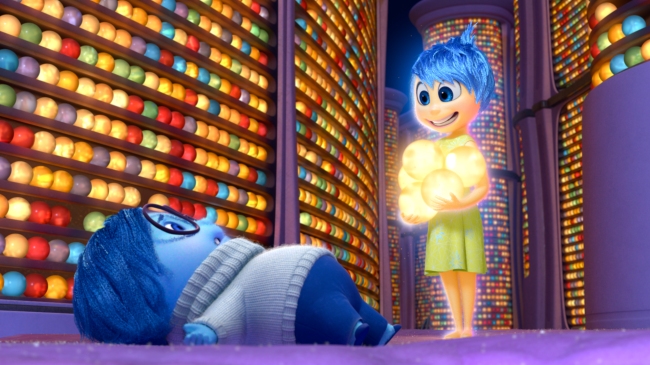 INSIDE OUT, from left: Sadness (voice: Phyllis Smith), Joy (voice: Amy Poehler), 2015. © Walt Disney Studios Motion Pictures / courtesy Everett Collection